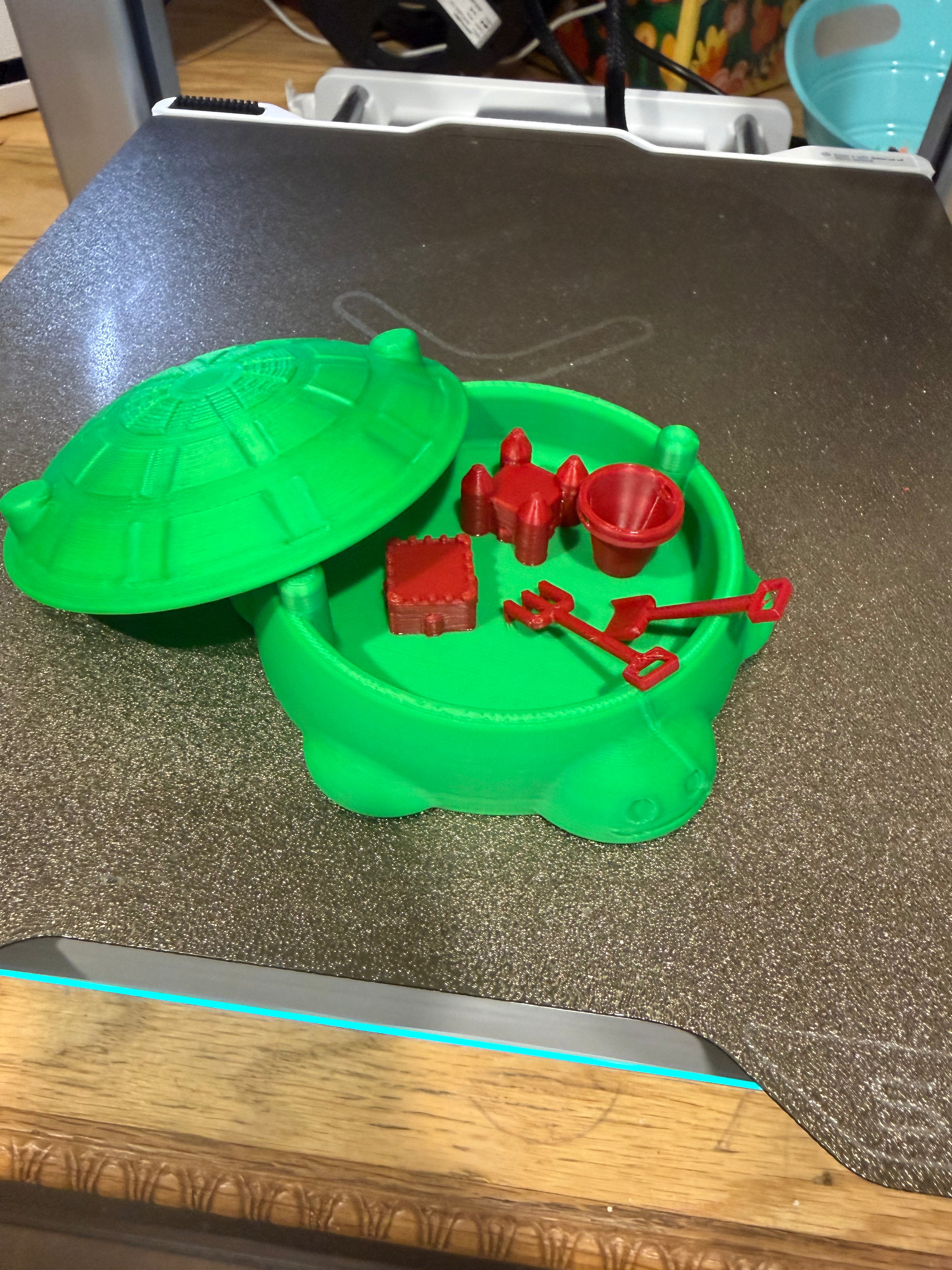 Mini turtle sandbox with beach toys